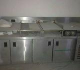 Under fridge with grill plate and tawa and